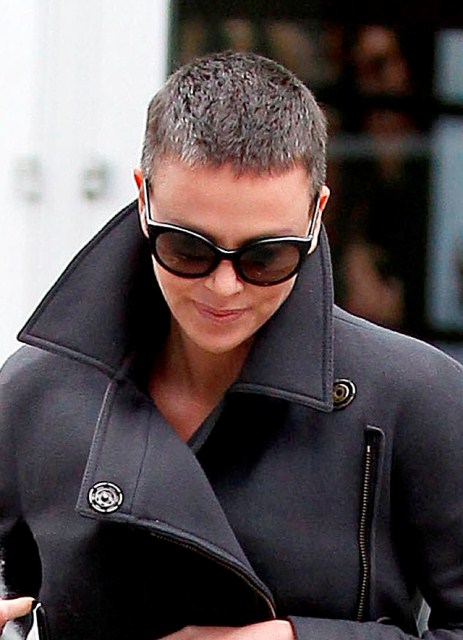 Charlize Theron (with mom) back in LA greying buzz cut 